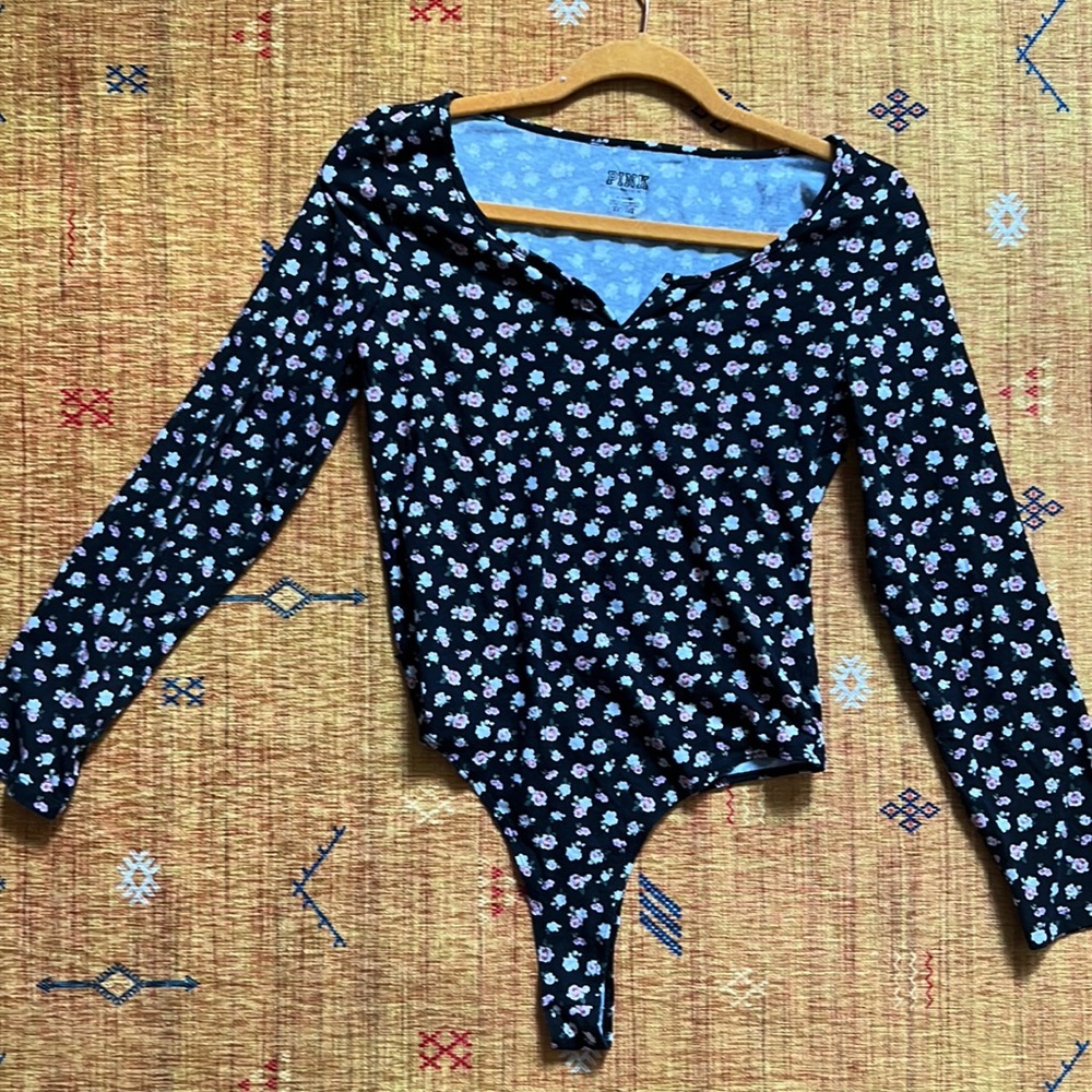 Floral long sleeve bodysuit. Size Medium. From Pink. Brand New